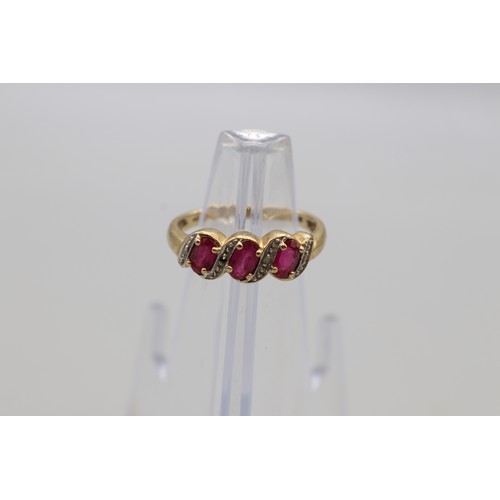 21 - Hallmarked 9ct yellow gold oval ruby three stone ring, weight 2.3g, size P; one diamond missing
Brad... 