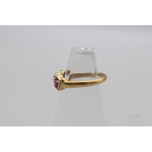 21 - Hallmarked 9ct yellow gold oval ruby three stone ring, weight 2.3g, size P; one diamond missing
Brad... 