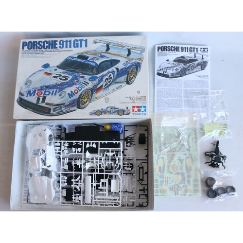 Four 1/24 scale plastic racing car model kits from Tamiya to include a ...