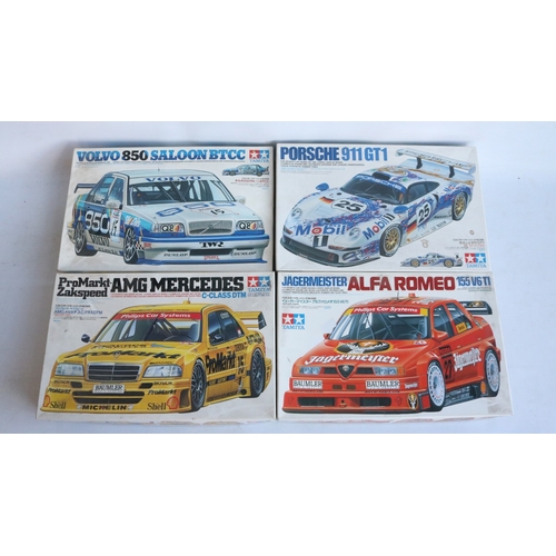 Four 1/24 scale plastic racing car model kits from Tamiya to include a ...