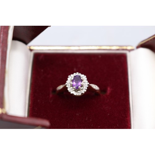 9 - Hallmarked 9ct yellow gold Amethyst faceted oval halo set ring with diamond-set shoulders, size L, w... 