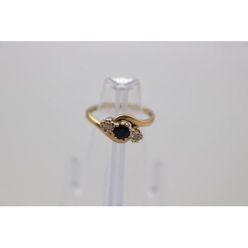 49 - Hallmarked 9ct yellow gold dark sapphire and illusion-set diamond three stone trilogy ring with twis... 