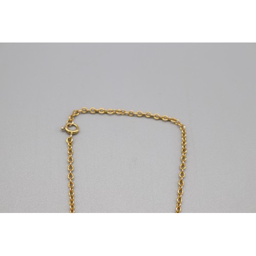 54 - Stamped 9ct yellow gold cross pendant with hand engraved scrollwork on a stamped 9ct yellow gold bel... 