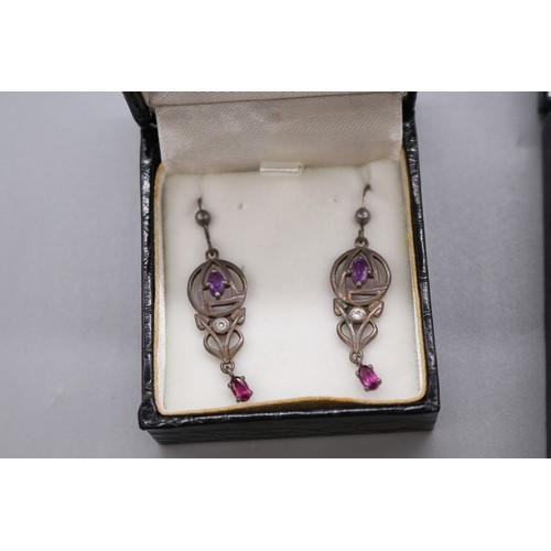57 - Lot of silver items, comprising a stamped sterling silver scrollwork hollow egg earrings and pendant... 