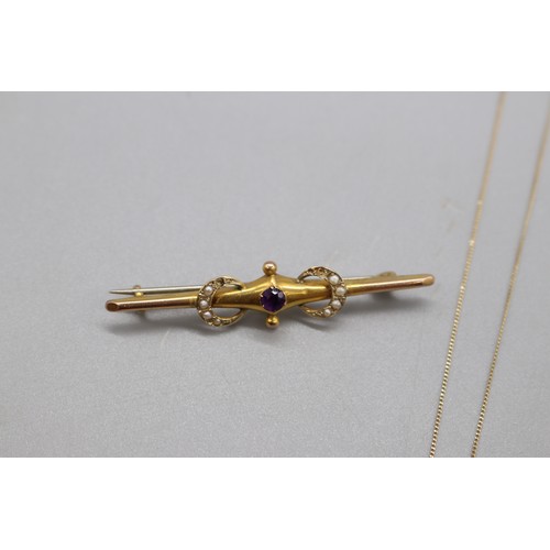 59 - Lot comprising a hallmarked 9ct yellow gold bar brooch set with a claw-set amethyst and seed pearl c... 