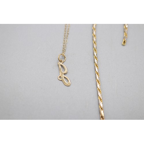 60 - Lot of hallmarked 9ct yellow gold items, comprising an oval dark sapphire halo set ring with CZ whit... 