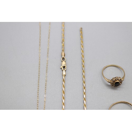 60 - Lot of hallmarked 9ct yellow gold items, comprising an oval dark sapphire halo set ring with CZ whit... 