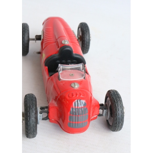 Two modern reissued clockwork racing car models from Schuco to include ...