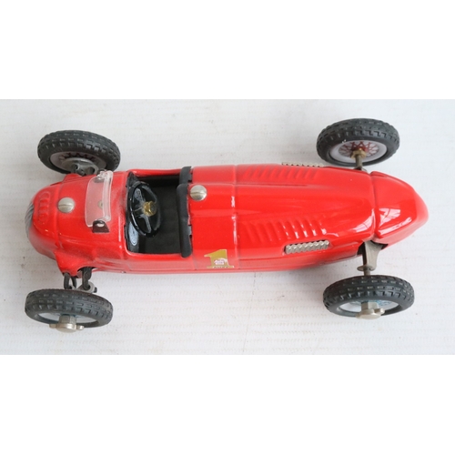 Two modern reissued clockwork racing car models from Schuco to include ...
