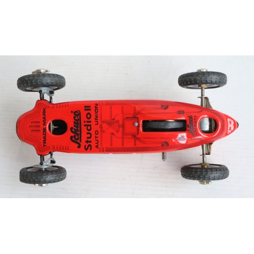 Two modern reissued clockwork racing car models from Schuco to include ...