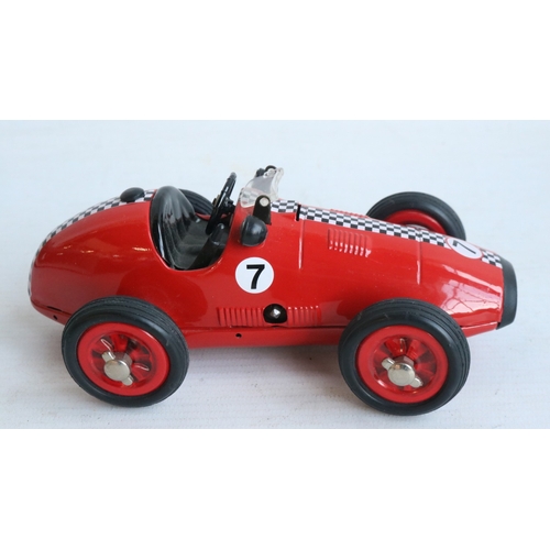 Two modern reissued clockwork racing car models from Schuco to include ...