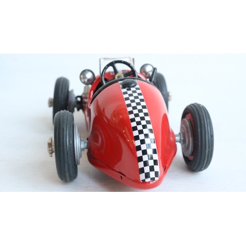 Two modern reissued clockwork racing car models from Schuco to include ...