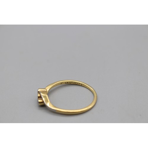 7 - Stamped 18ct yellow gold and platinum trilogy ring, set with three small bezel-set diamonds, size Q,... 