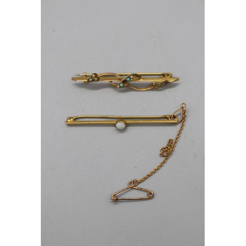 20 - Two gold bar brooches, comprising a stamped 9ct yellow gold bar brooch with a millgrain bezel-set op... 