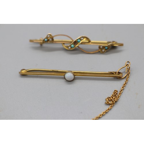 20 - Two gold bar brooches, comprising a stamped 9ct yellow gold bar brooch with a millgrain bezel-set op... 