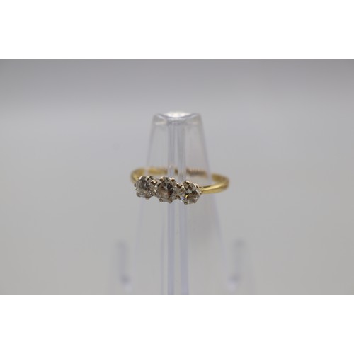 6 - Stamped 18ct yellow gold diamond trilogy ring, set with an approximately 0.30ct round brilliant cut ... 