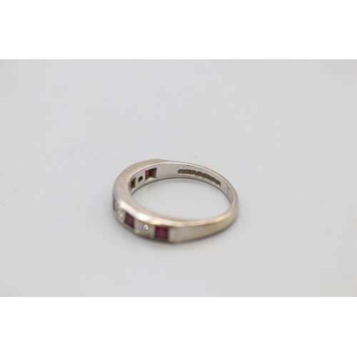 4 - Hallmarked 18ct white gold ruby and diamond eternity ring, set with princess cut rubies and round br... 