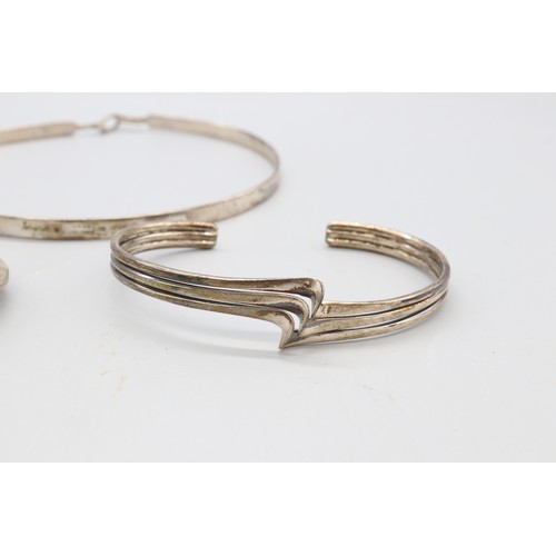 Lot of two silver bangles and a silver collarette, comprising a ...