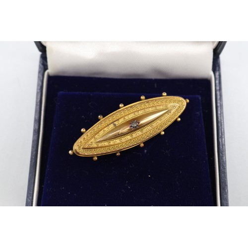 18 - Stamped 9 yellow metal marquise shape bar mourning brooch, with a memento mori glazed reverse and a ... 