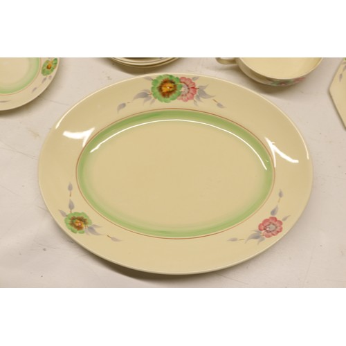 795 - Collection of Clarice Cliff tea and dinner ware, incl. honey pot, two teapots, teacups, soup cups, s... 