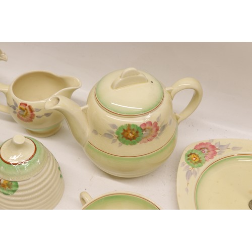 795 - Collection of Clarice Cliff tea and dinner ware, incl. honey pot, two teapots, teacups, soup cups, s... 
