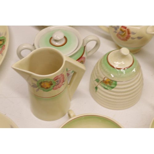 795 - Collection of Clarice Cliff tea and dinner ware, incl. honey pot, two teapots, teacups, soup cups, s... 