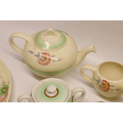 795 - Collection of Clarice Cliff tea and dinner ware, incl. honey pot, two teapots, teacups, soup cups, s... 