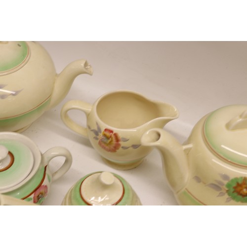 795 - Collection of Clarice Cliff tea and dinner ware, incl. honey pot, two teapots, teacups, soup cups, s... 