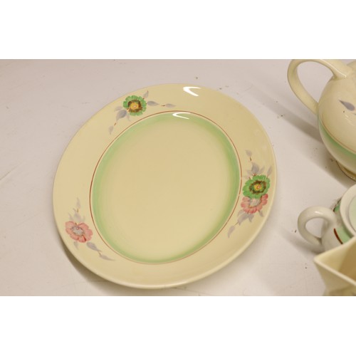 795 - Collection of Clarice Cliff tea and dinner ware, incl. honey pot, two teapots, teacups, soup cups, s... 