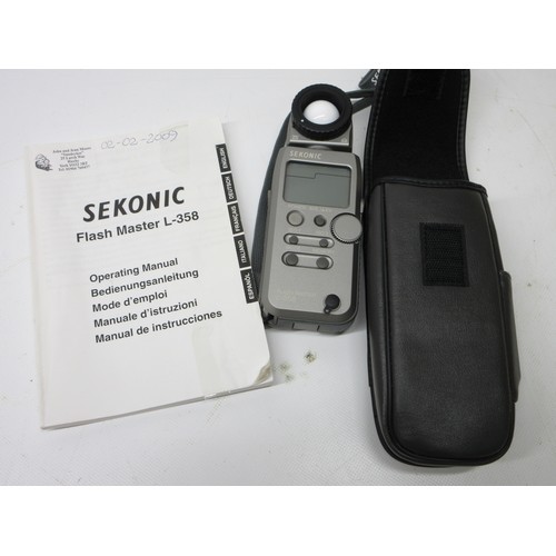 707 - Canon EOS 800D digital camera (lacking battery) with EW-63C lens, Canon ET-74B lens,  Manfrotto trip... 