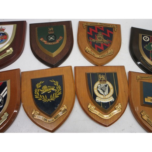 Sixteen military regimental plaques and a Guinness barometer. Mostly ...