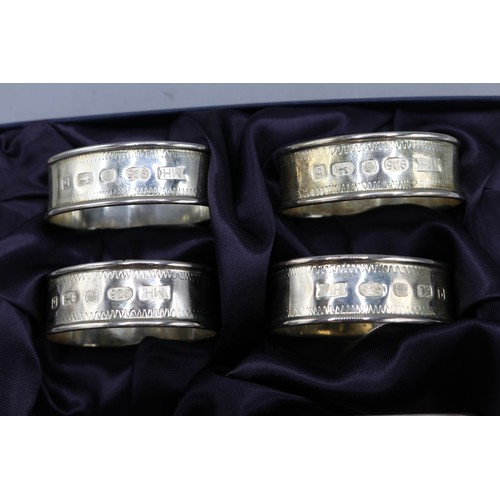  Boxed set of hallmarked silver napkin rings with zig zag borders, by Mark Houghton Ltd, Sheffield 20... 