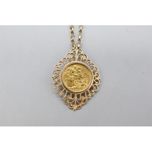 Hallmarked 9ct yellow gold scrollwork open pendant with mounted 1925 George V gold sovereign on a 24... 