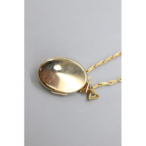 5 - A hallmarked 9ct yellow gold ruby and diamond locket on a hallmarked 9ct yellow gold barleycorn link... 