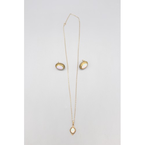 12 - A hallmarked 9ct yellow gold opal pendant and earring suite, comprising a pair of oval opal rope-edg... 