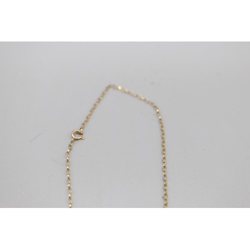 12 - A hallmarked 9ct yellow gold opal pendant and earring suite, comprising a pair of oval opal rope-edg... 