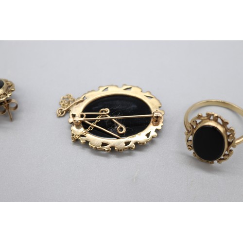 13 - Hallmarked 9ct yellow gold onyx jewellery set comprised of oval cut onyx ring with scrollwork border... 