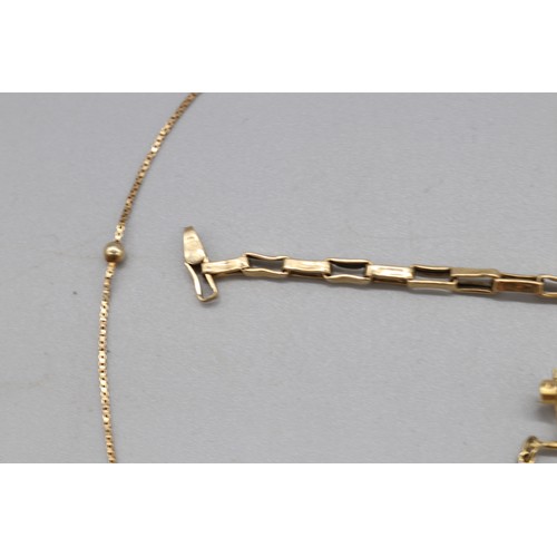 26 - A lot of hallmarked 9ct yellow gold jewellery, comprising a hallmarked 9ct yellow gold box link brac... 