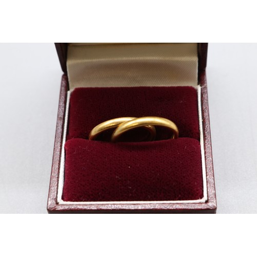 15 - A pair of 22ct yellow gold court wedding bands, comprising a hallmarked Birmingham example dated 184... 