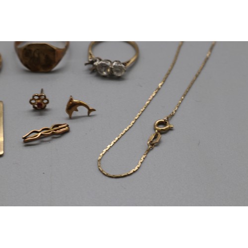 33 - Mixed Hallmarked 9ct yellow gold jewellery comprised of three 9ct yellow gold rings (all damaged) va... 