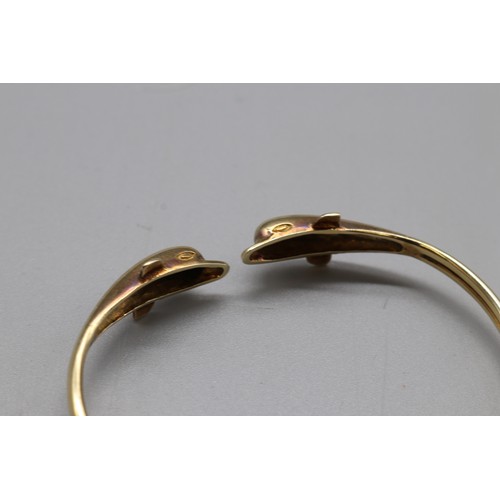 22 - Stamped 14ct yellow gold dolphin torque bangle and matching expandable ring size N (aprox) combined ... 