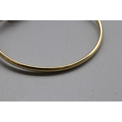 22 - Stamped 14ct yellow gold dolphin torque bangle and matching expandable ring size N (aprox) combined ... 