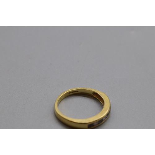 34 - Hallmarked 18ct yellow gold aquamarine and diamond channel set eternity ring, size O, weight 4.01g
B... 