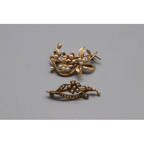 16 - A lot of two hallmarked gold seed pearl brooches, comprising a stamped 15ct yellow gold multi-seed p... 