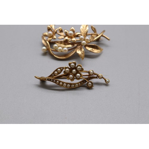 16 - A lot of two hallmarked gold seed pearl brooches, comprising a stamped 15ct yellow gold multi-seed p... 