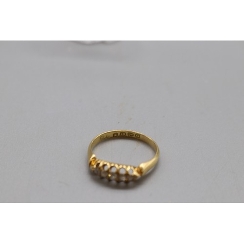 7 - A hallmarked 18ct gold five-stone diamond boat-head ring, Chester assay 1890–1891, set with five gra... 