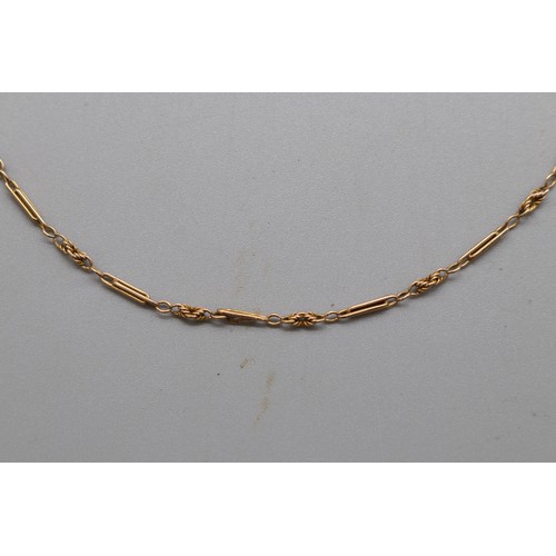 18 - A stamped 15ct yellow gold trombone link necklace chain with a pin barrel clasp, length approximatel... 