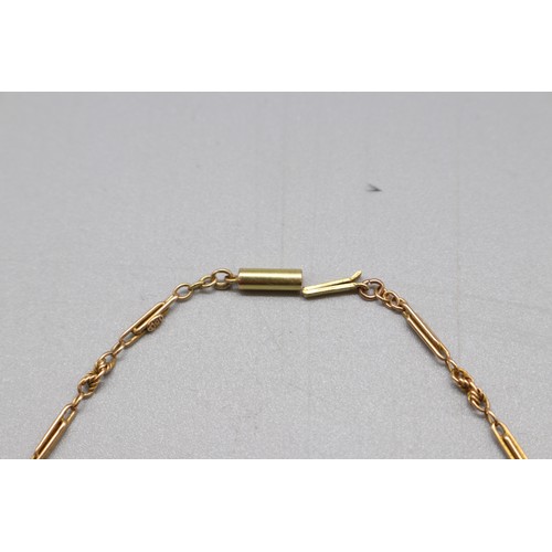 18 - A stamped 15ct yellow gold trombone link necklace chain with a pin barrel clasp, length approximatel... 