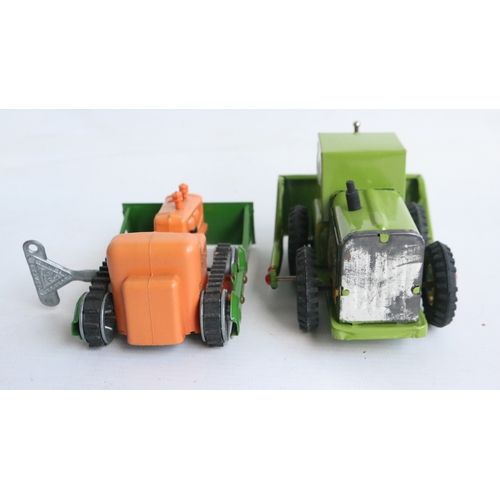 Three vintage boxed bulldozer models to include small scale tinplate ...