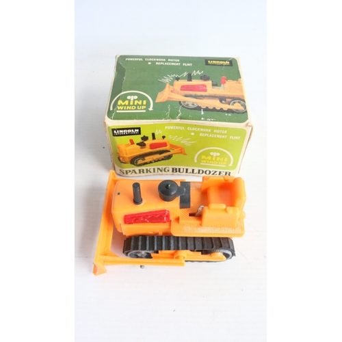 Collection of mostly plastic bulldozer and similarly themed plant ...